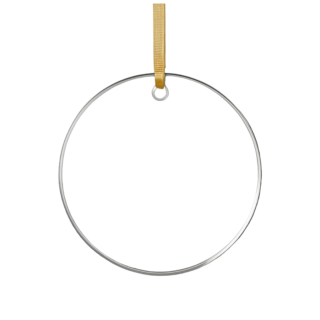 Round clear ornament with a gold hanging strap on a white background