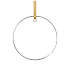 Round clear ornament with a gold hanging strap on a white background